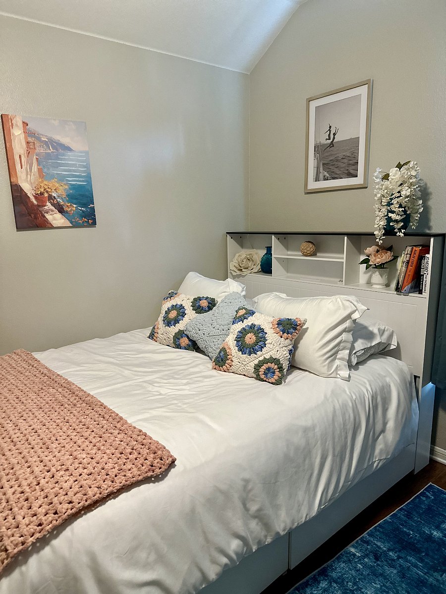 Bedroom with handcrafted throw pillows and blanket that are super soft!