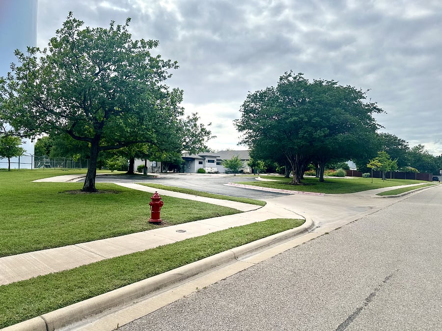 View from my house to the club house with all the amenities! Pool, gym, playground, tennis/basketball courts, picnic tables! This is directly across the street from my home.