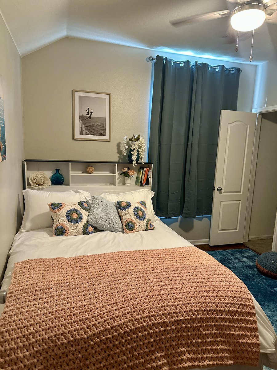 Bedroom with handcrafted throw pillows and blanket that are super soft!