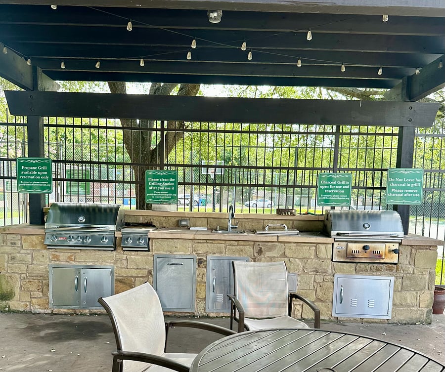 Outdoor, Covered BBQ Pits with plenty of comfortable, covered seating for guests.