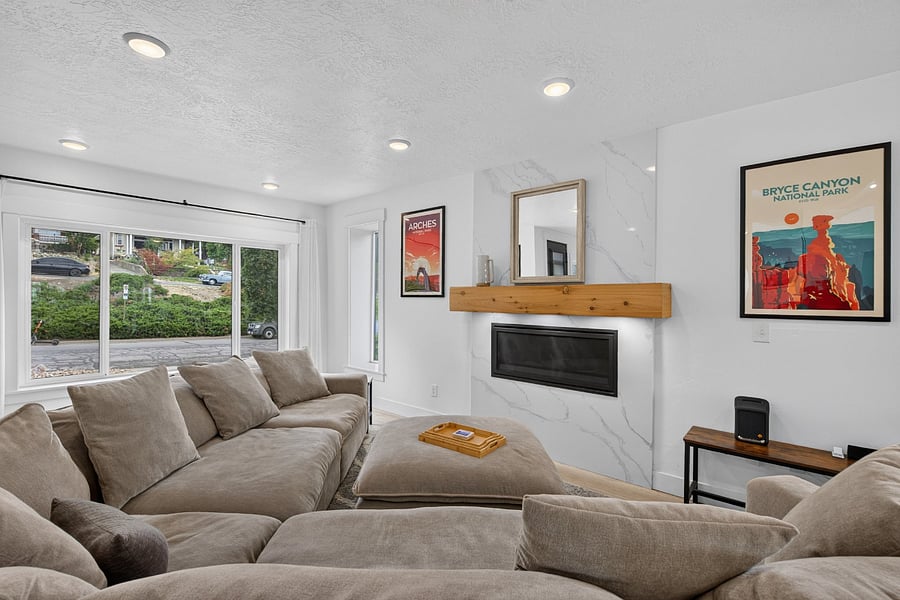 Living room with fireplace, view out the front window