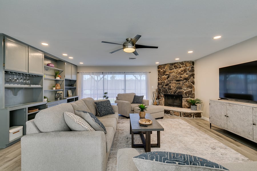 Great Room with built in cabinet, multi-slide slider to rear yard and wood burning fireplace