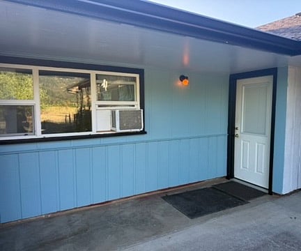 East facing bedroom window and front door. See air conditioner in window.