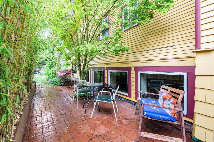 quiet garden patio with outside dining space, fire pit and barbecue