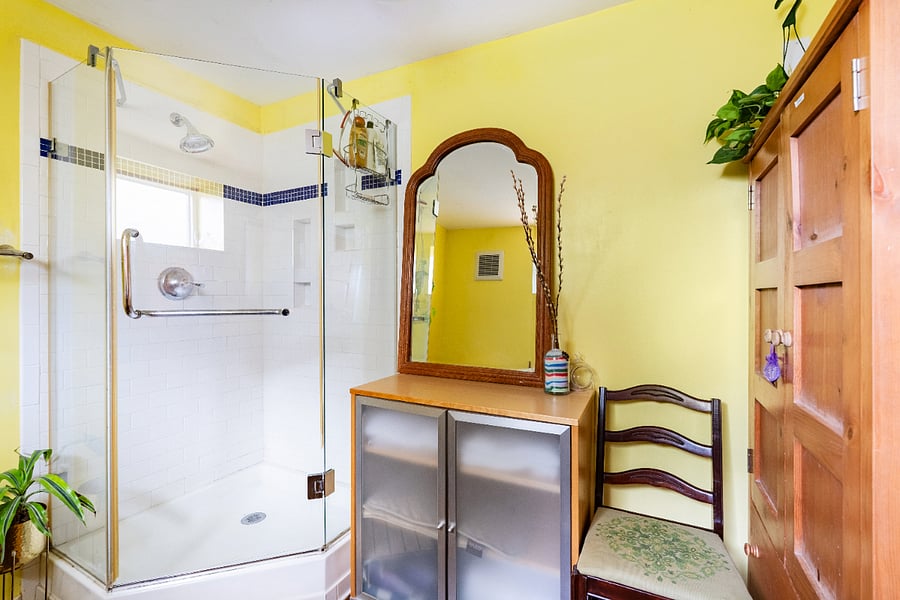 spacious bathroom with shower and extra storage