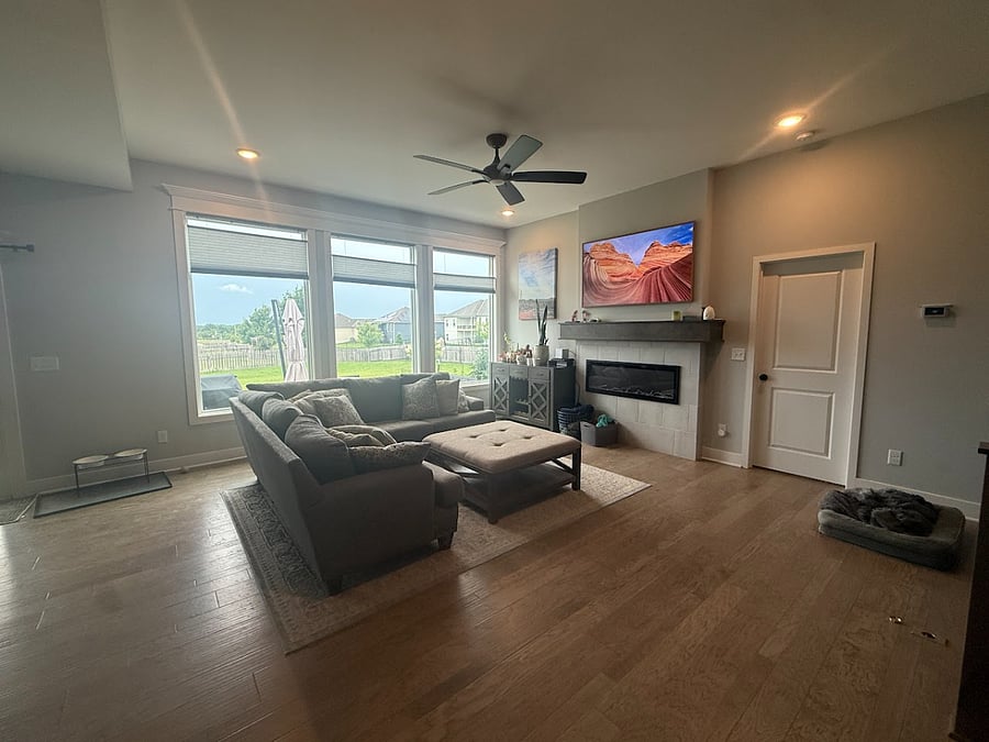 Shared living room with smart TV and fireplace