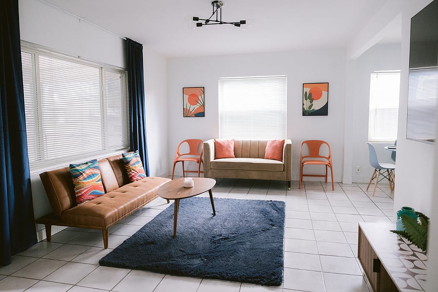 LIVING ROOM WITH FUTON STYLE COUCH & LOVESEAT
