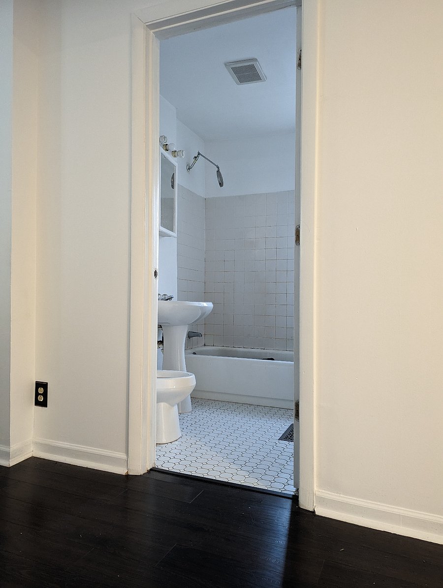 bathroom with tub and shower