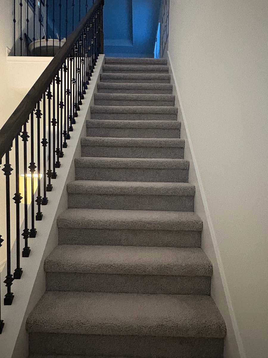 Stairs to the guest bedroom, bathroom, media room for tenant for privacy.