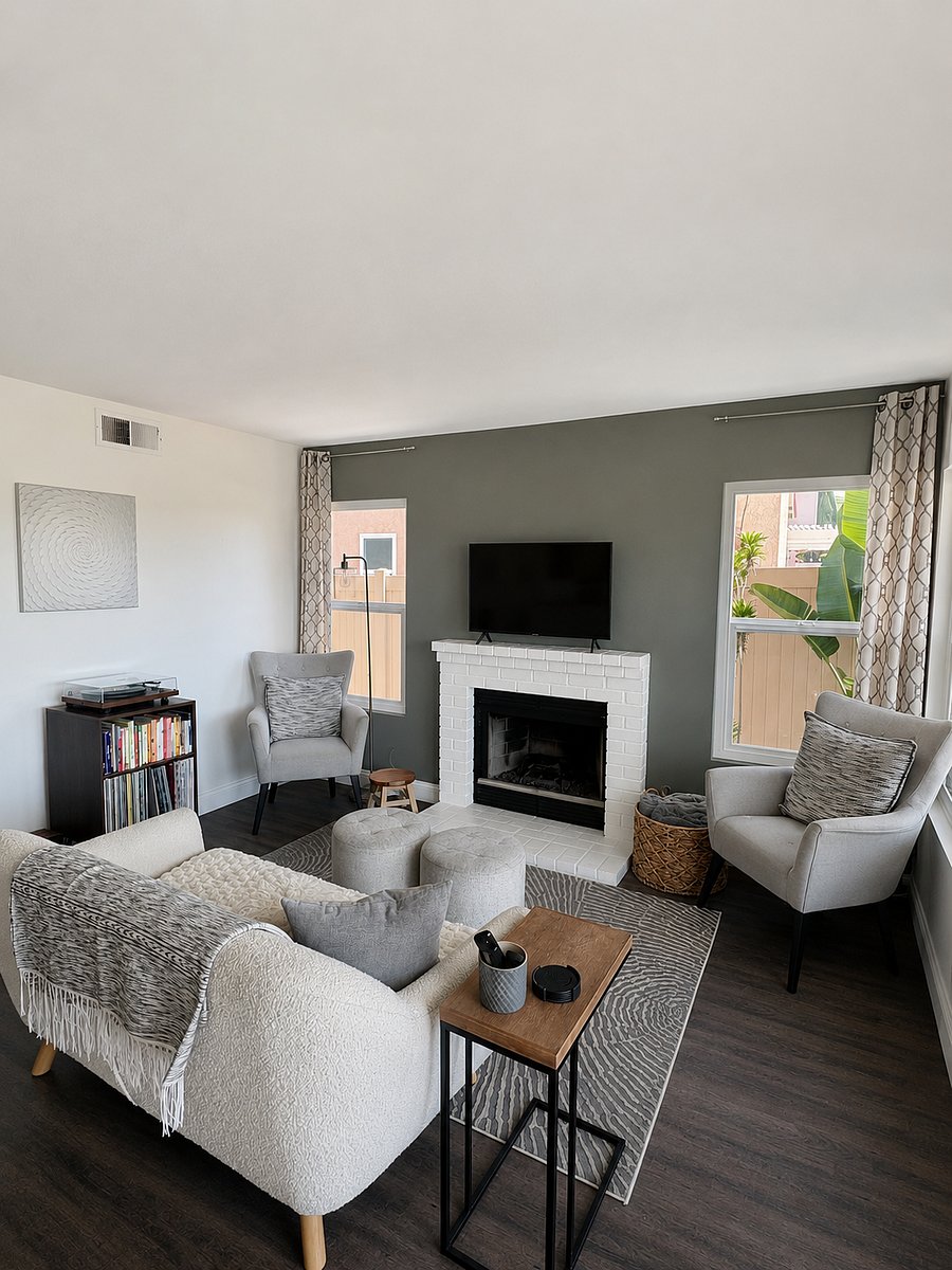 Sitting room with gas fireplace, record player, and smart TV