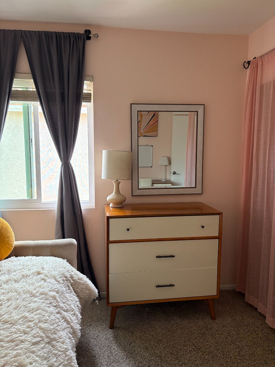 Dresser and closet in twin bedroom