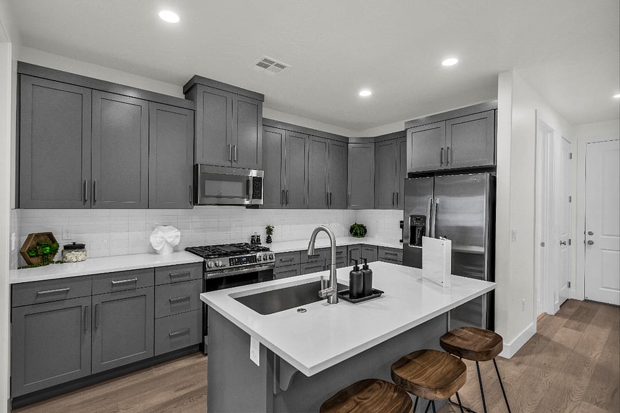 Well appointed kitchen with bar stools.