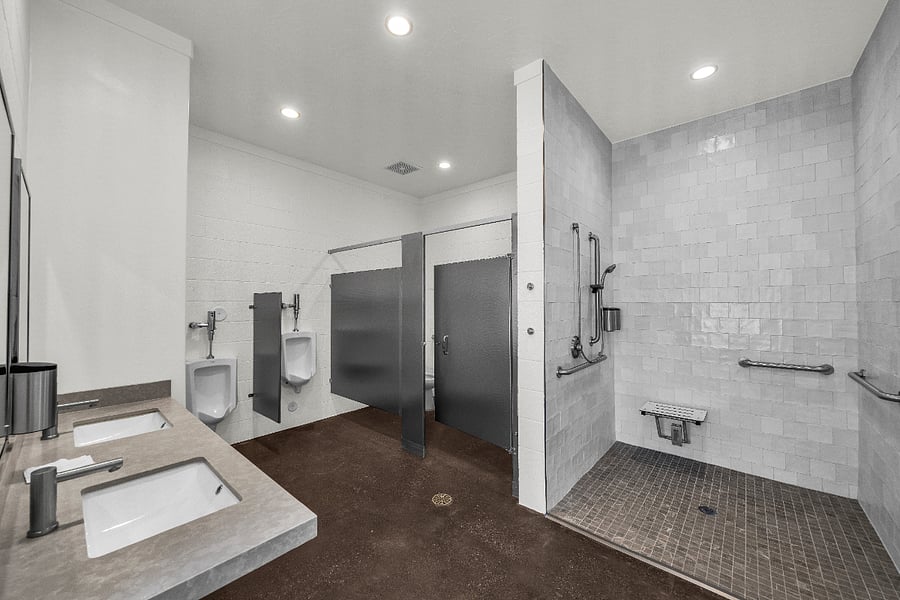 Shower and dressing room in the shared pool area.