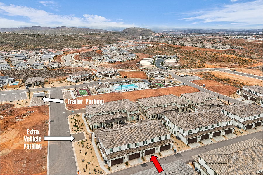 Overall view of the property in relation to the pool and additional parking area.
