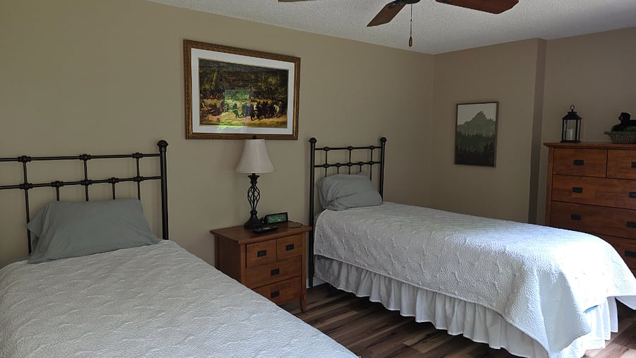 Upstairs bedroom with two twin beds.