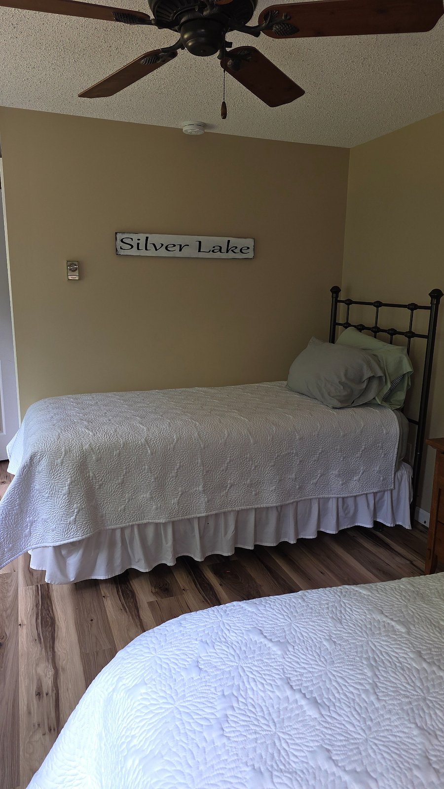 Upstairs bedroom with two twin beds.