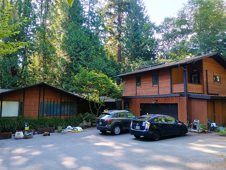 full property with main house. apartment is over garage. off-street parking on right side of drive