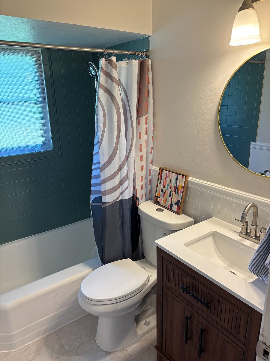 Full bathroom with shower tub combo