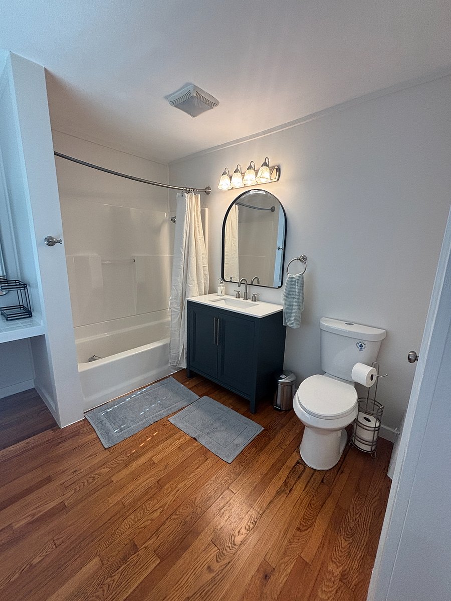Primary bathroom with tub and shower combo