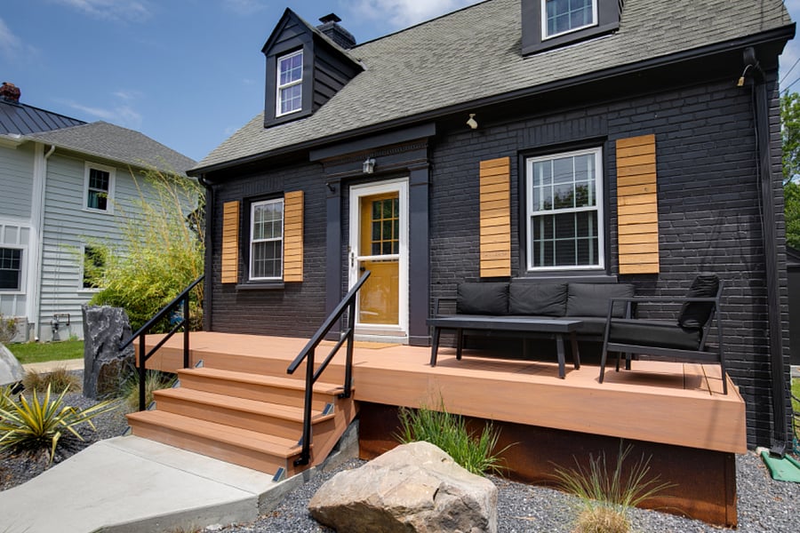 The outdoor sofa, chair, and table make the perfect place to enjoy a beautiful day just outside the front door.