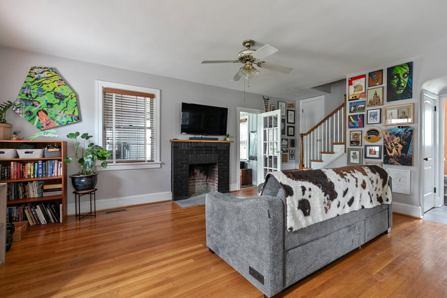 The living room features a large smart tv, expandable couch perfect for snuggling up and napping, as well as a Crosley record player/bluetooth speaker. 
