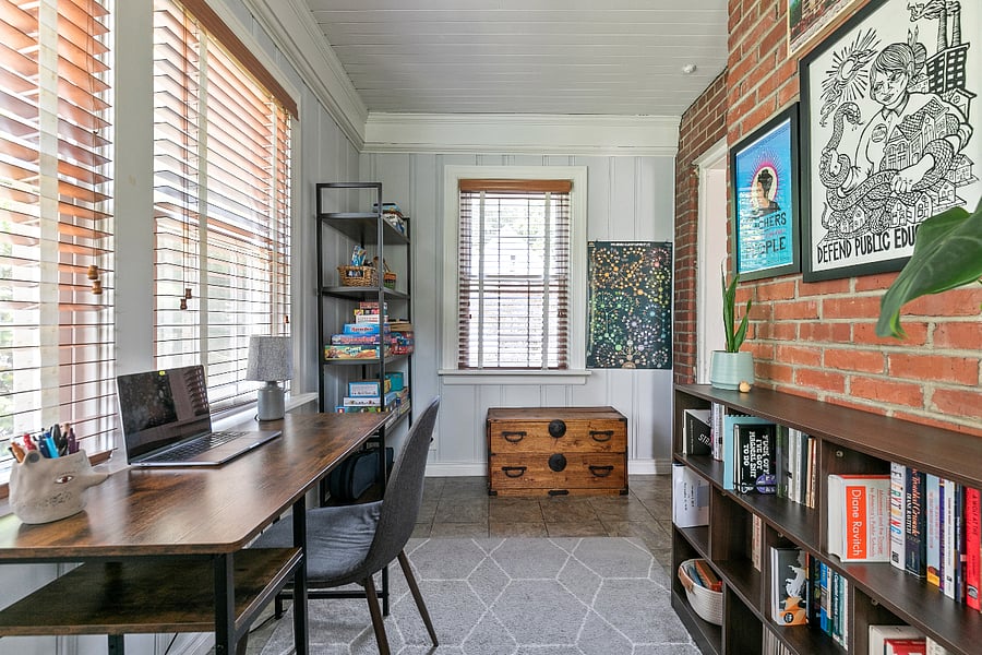 The first floor also features a lovely sunroom that is ideal for a home office space or playroom.