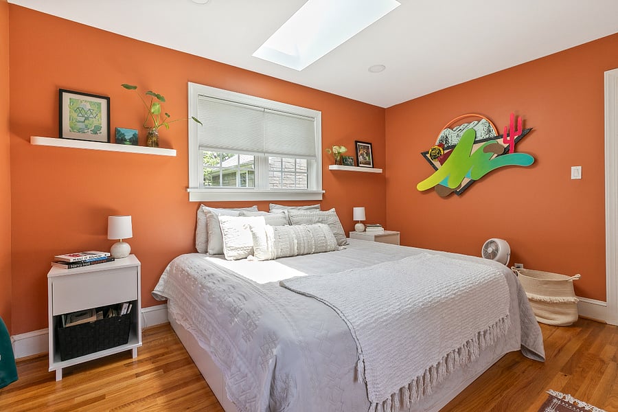 All three bedrooms are upstairs, in an ideal configuration for single travelers, parents with kids, or friends sharing the house. One bedroom is drenched in natural light from windows across three walls, in addition to the skylight that allows you to sleep under the stars in the luxurious comfort of a California king bed with designer linens. Bedside tables (on both sides) with matching lamps and plenty of outlets means everyone gets to enjoy bedtime at their own pace. This room features a large walk-in closet.