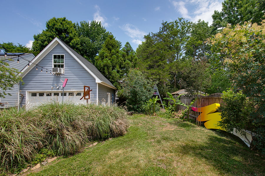 Featuring cafe lighting, a fire pit, gas grill, hand built play fort, and small scale concrete skate ramp, you wont find a backyard like this anywhere else. Garage building is the owner's studio and will not be accessible to renters.