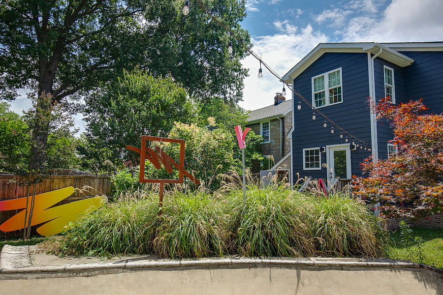Featuring cafe lighting, a fire pit, gas grill, hand built play fort, and small scale concrete skate ramp, you wont find a backyard like this anywhere else. Garage building is the owner's studio and will not be accessible to renters.