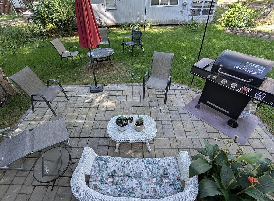 Outdoor area perfect for relaxing  and small gatherings. Patio furniture, grill, and fire pit included.