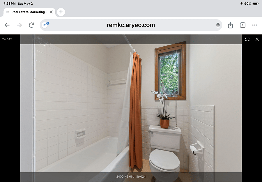 Main bath and shower combo at the end of hallway