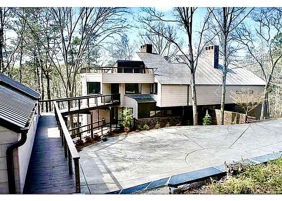 View of Main Estate home, apartment above 3 car garage and faces away from Main home.