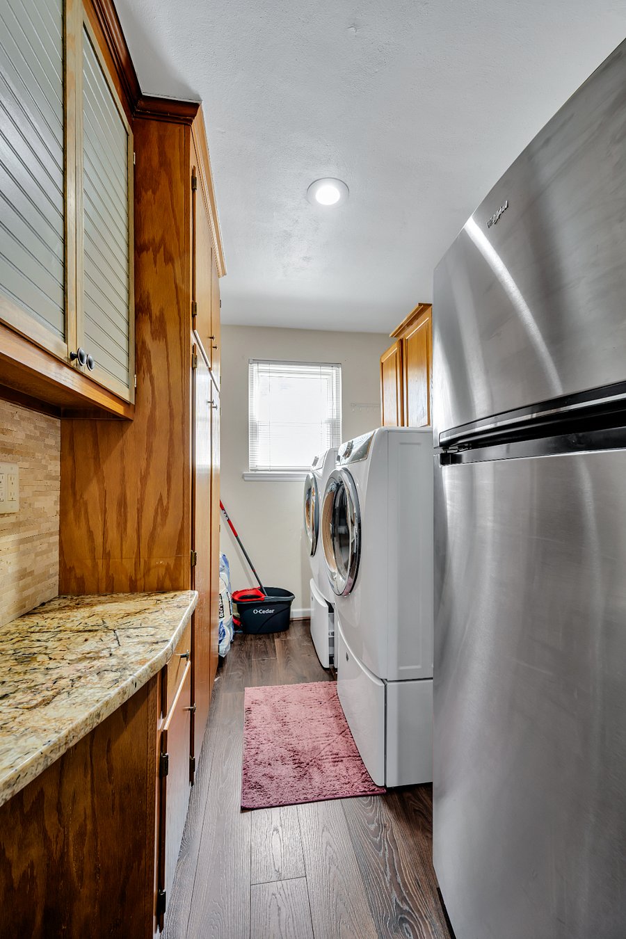 Pantry with 2nd fridge, washer and dryer. Also has cordless vacuum cleaner and clothes steamer.