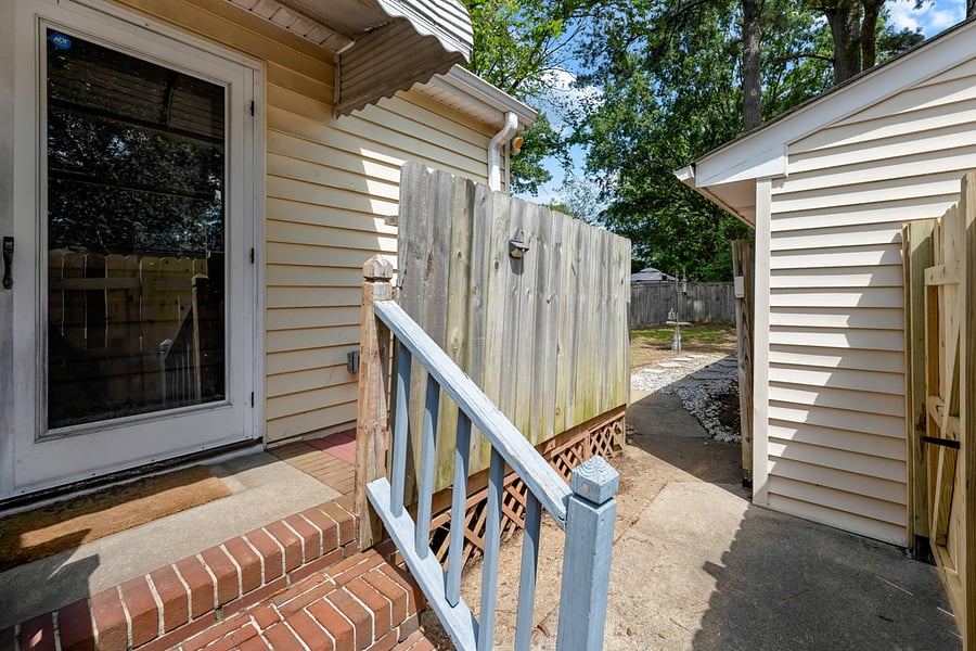 Back door leading to fully fenced back yard.