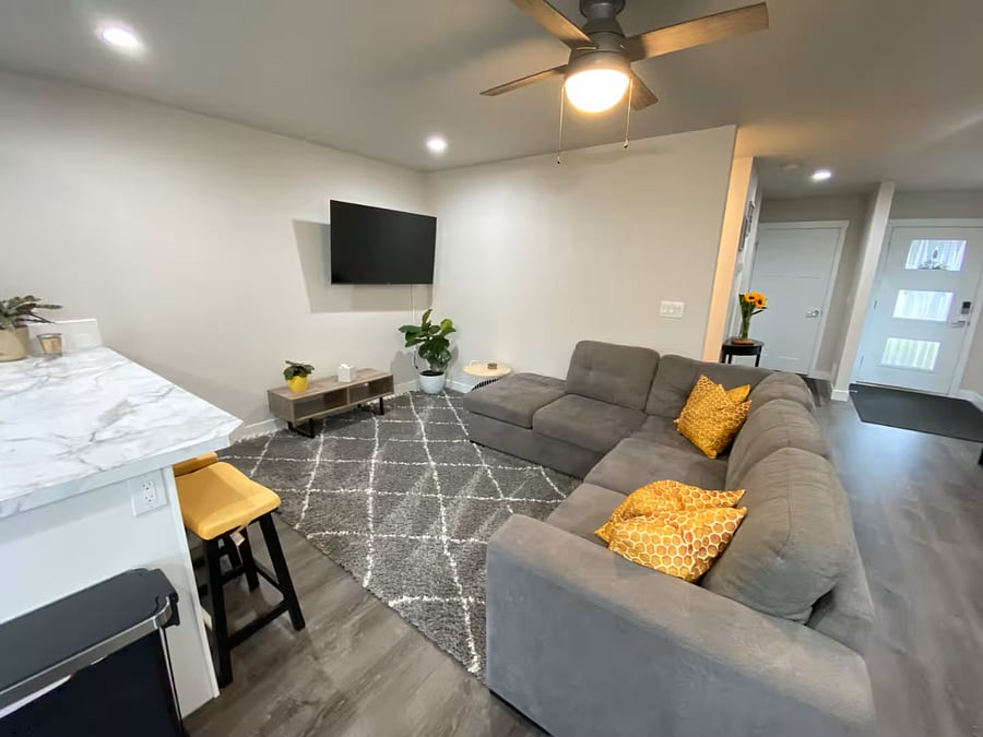 Livingroom with pull-out full-size bed in the section. WIFI extenders allow you to log into all your favorite streaming devices and enjoy family movie nights!