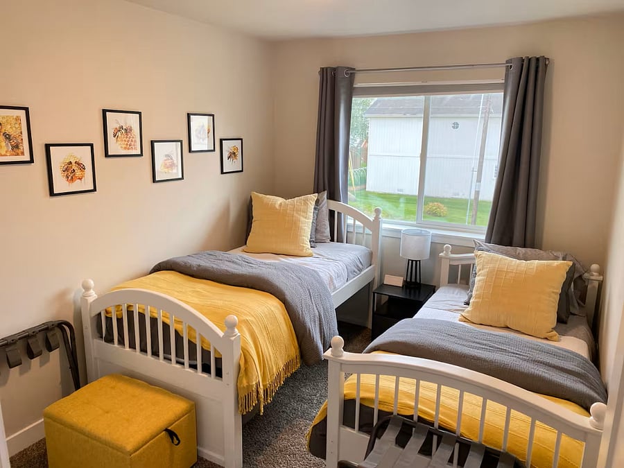 Two luxurious twin size beds with plenty of pillows and blankets to suit any comfort level. Blackout shades AND blackout curtains ensure a pitch-black bedroom, even in the land of the midnight sun. Don's miss the available luggage racks in each room!