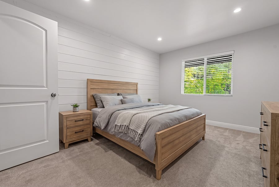 Bedroom (Queen Bed)
Bright, airy, and beautifully designed! This 2nd-floor queen bedroom boasts a stunning white shiplap accent wall, light oak furnishings, walk-in closet, and ultra-comfortable bedding.