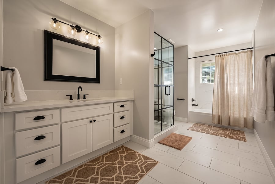 Bathroom (Shower & Tub)
Modern elegance meets function! Clean 2nd-floor bath equipped with a glass walk-in shower, deep soaking tub with linen curtain, white vanity, and plush towels for a spa-like reset.