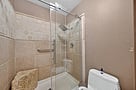 Master bedroom ensuite. Stone countertop vanity with cabinets not pictured