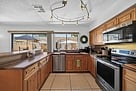 Kitchen with stainless steel appliances, convection oven with magnetic cooktop