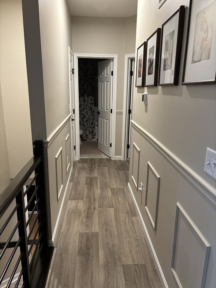 1st floor hallway leading to full bath shared by two bedrooms.