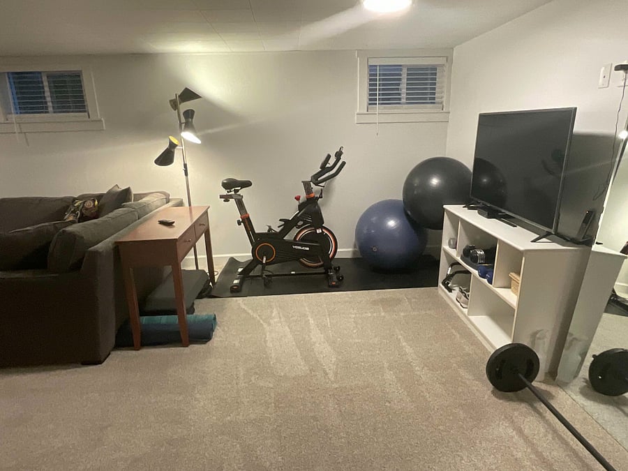 Shared- workout area. Spin bike, yoga mats, TV, exercise balls, free weights, barbell, foam roller, step.