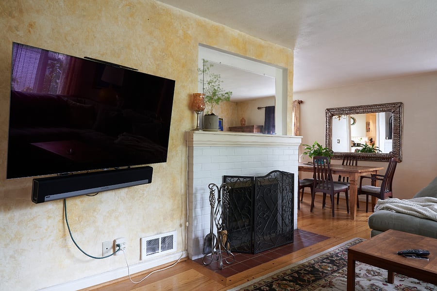 Adjustable SMART TV with sound bar. 