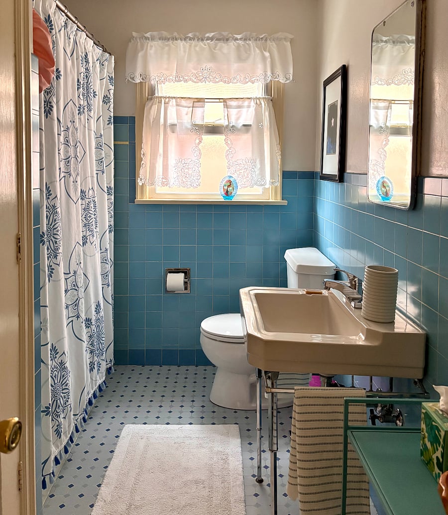 The upstairs' primary bathroom offers plenty of storage space. We provide bath linens and a blow dryer.