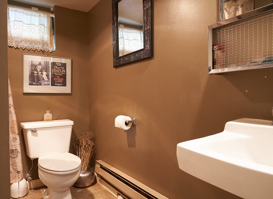 Downstairs bathroom. Tub and shower with great water pressure. Plenty of storage space.