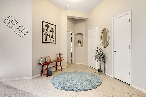 Front Entry & Door to Primary BR - Furnishings and decorations have changed since photo.
