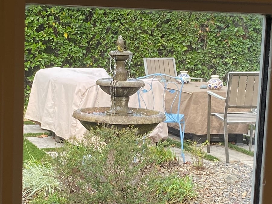 You can open the French Doors to enjoy the sound and sight of the fountain.
