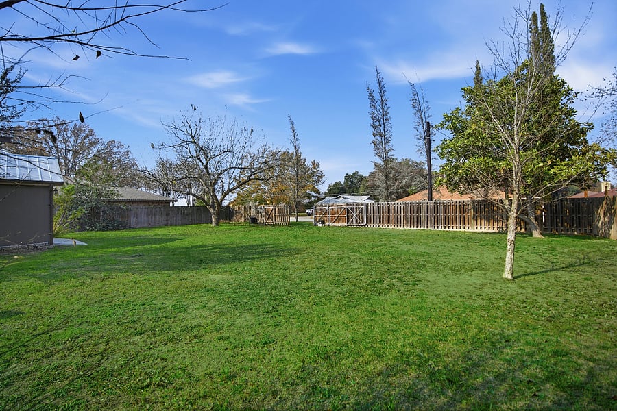 large front yard and whole property is completely fenced