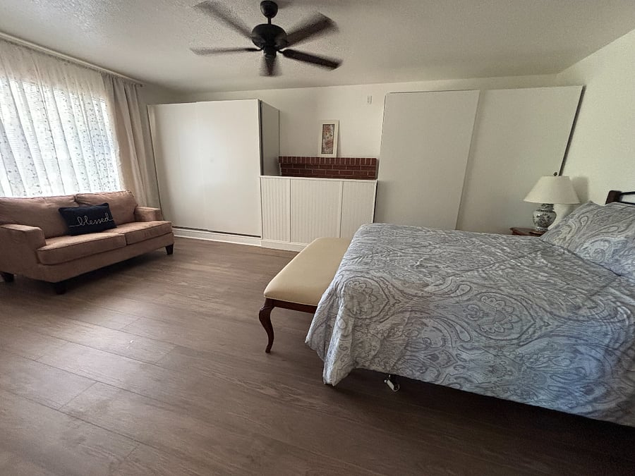 Large bedroom with queen sized bed and loads of closet space. Third bathroom across small hall.