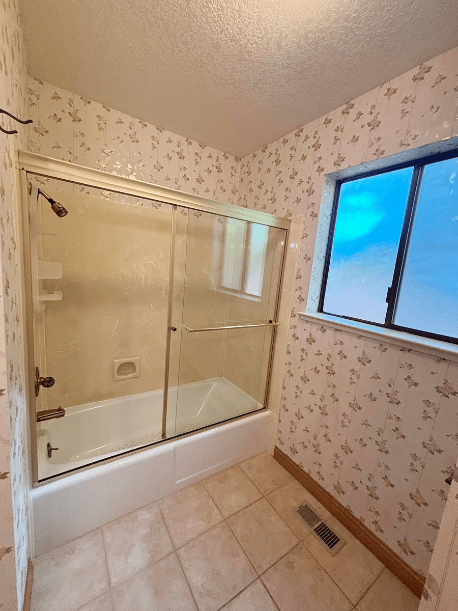 Shower over tub in hall bathroom